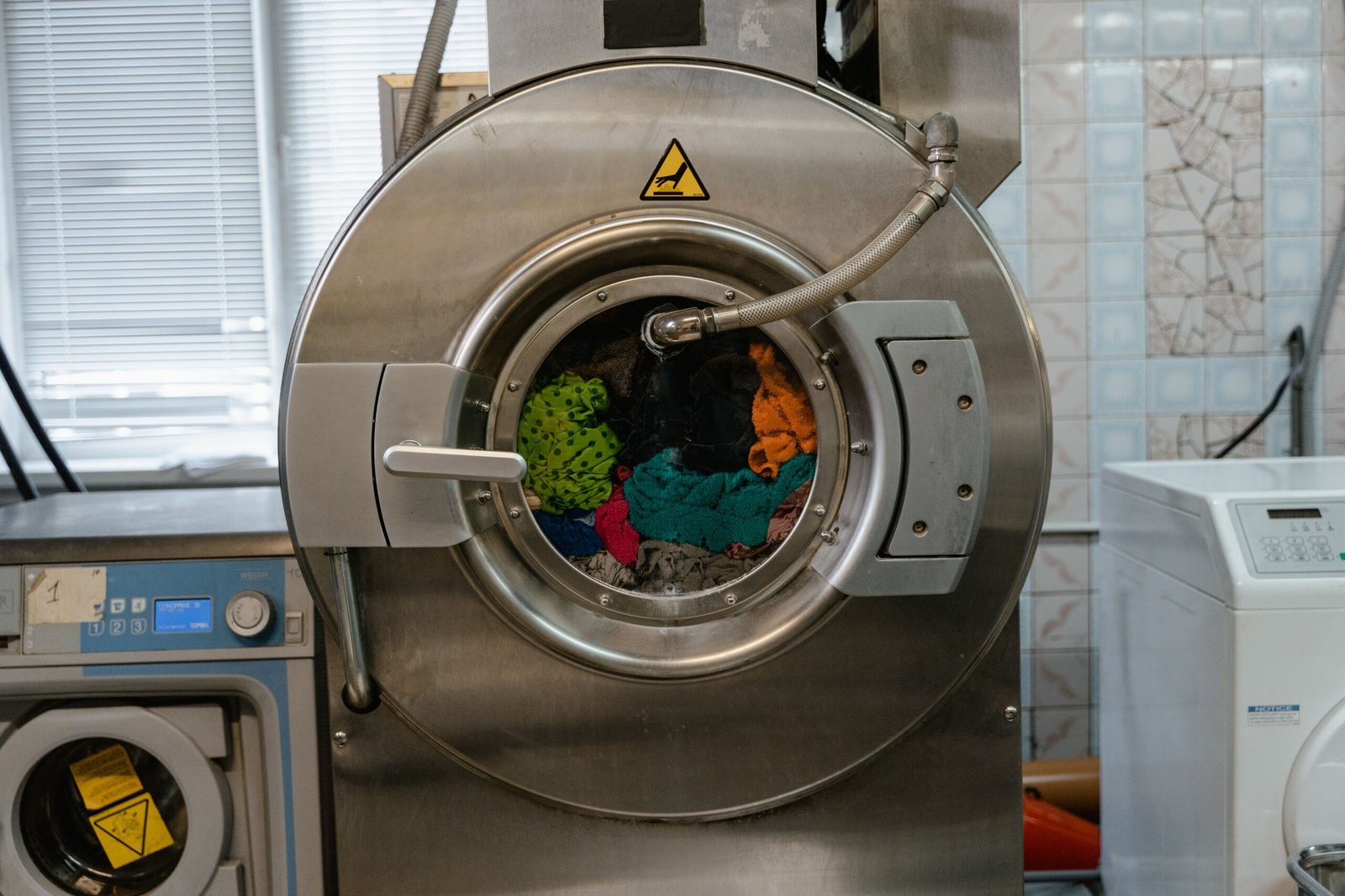 Tumble dryer duct cleaning for fire safety compliance, laundry extraction ductwork cleaning, commercial laundry duct cleaning, lint removal and dryer vent cleaning UK, Extract Assure